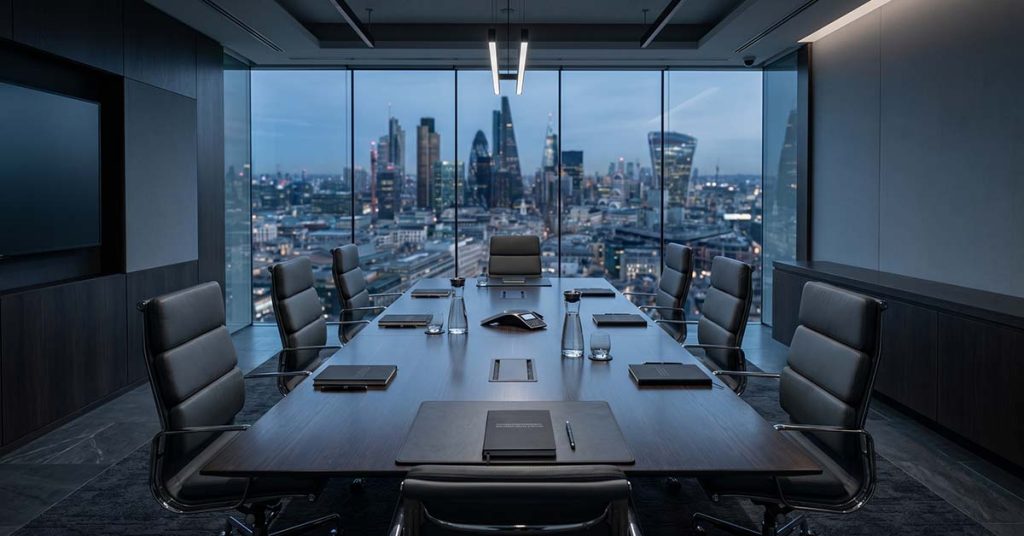 Sleek corporate boardroom table representing enterprise risk mitigation and Section 198 LRA compliance for temporary staffing.